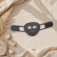 Masque LED visage Hello Face M500S coloris noir sur un linge en lin beige